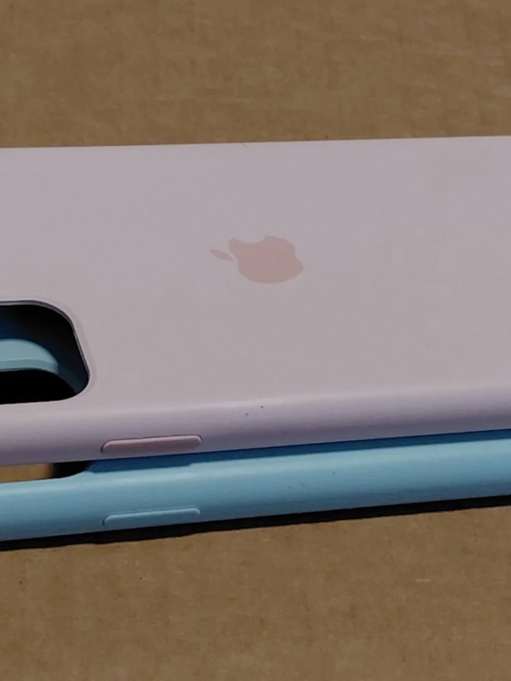 Apple silicone phone cases for the iPhone 11 Pro in light pink and seafoam green